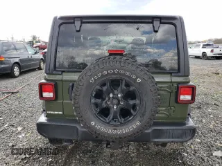 2021 Jeep Wrangler Sport z VIN 1C4GJXAN5MW668474, wystawiony jako Copart lot #53238095 z przebiegiem Nie podano mil oraz Szkody całkowita. Historia ofert i sprzedaży dostępna na DreamBid. Obrazek 6.