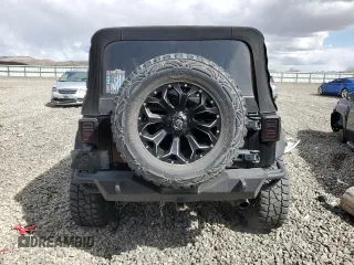 2010 Jeep Wrangler Unlimited Sahara with VIN 1J4HA5H13AL182071, listed as a Copart auction lot 51696665 with 178,026 mi miles and Salvage Title. Bid and sale history available at carsss.com. Image 6.