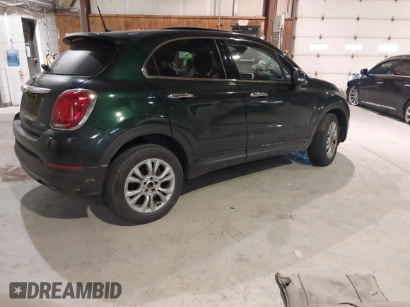 2016 FIAT 500X Lounge with VIN ZFBCFYDT1GP470721, listed as a IAAI auction lot 41293223 with 104,478 mi miles and . Bid and sale history available at DreamBid. Image 4.
