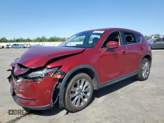 2019 Mazda CX-5 Grand Touring with VIN JM3KFBDM4K1510047, listed as a Copart auction lot 58303085 with 80,435 mi miles and Salvage title. Bid and sale history available at DreamBid. Image 1.