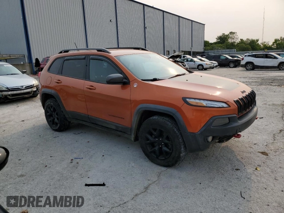 2015 Jeep Cherokee Trailhawk with VIN 1C4PJMBS0FW675807, listed as a Copart auction lot 58800615 with 109,019 mi miles and Salvage title. Bid and sale history available at DreamBid. Image 4.