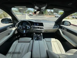 2020 BMW X7 xDrive40i z VIN 5UXCW2C06L0E74740, wystawiony jako Copart lot #55679695 z przebiegiem 21 686 mil mil oraz Szkody całkowita. Historia ofert i sprzedaży dostępna na DreamBid. Obrazek 9.