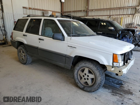 1995 Jeep Grand Cherokee Laredo with VIN 1J4GZ58Y0SC572757, listed as a Copart auction lot 52733375 with 160,588 mi miles and Salvage Title. Bid and sale history available at carsss.com. Image 4.