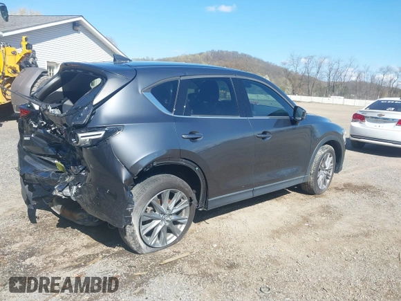 2020 Mazda CX-5 Grand Touring with VIN JM3KFBDM1L0821975, listed as a IAAI auction lot 40088794 with 68,895 mi miles and . Bid and sale history available at DreamBid. Image 4.