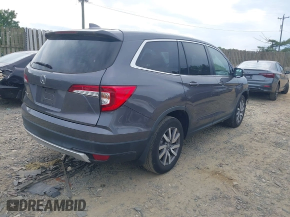 2019 Honda Pilot EX-L with VIN 5FNYF5H45KB018293, listed as a IAAI auction lot 42318481 with 76,617 mi miles and . Bid and sale history available at DreamBid. Image 4.