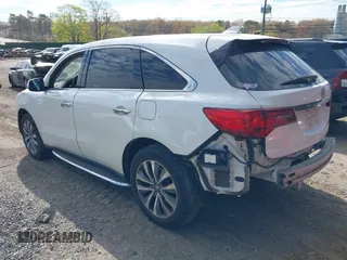 2016 Acura MDX w/Tech with VIN 5FRYD4H43GB014801, listed as a IAAI auction lot 39256120 with 73,769 mi miles. Bid and sale history available at carsss.com. Image 3.