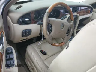 2004 Jaguar XJ with VIN SAJWA71C44SG34094, listed as a Copart auction lot 74969004 with 0 mi miles and Salvage Title. Bid and sale history available at carsss.com. Image 8.