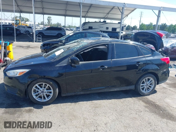 2018 Ford Focus SE z VIN 1FADP3FE9JL303933, wystawiony jako IAAI lot #42530171 z przebiegiem Nie podano mil oraz . Historia ofert i sprzedaży dostępna na DreamBid. Obrazek 13.