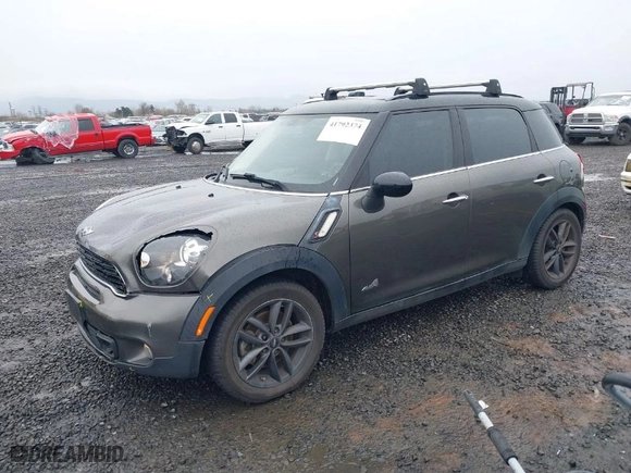 2014 MINI Cooper Countryman S with VIN WMWZC5C56EWP40320, listed as a IAAI auction lot 41792374 with 103,894 mi miles. Bid and sale history available at carsss.com. Image 2.