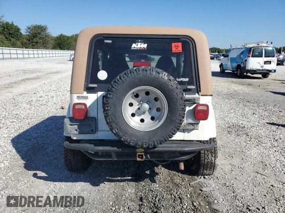 2000 Jeep Wrangler Sahara with VIN 1J4FA59SXYP764539, listed as a Copart auction lot 52707385 with 136,159 mi miles and Salvage title. Bid and sale history available at DreamBid. Image 6.