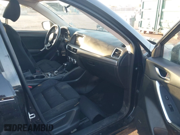 2016 Mazda CX-5 Touring with VIN JM3KE2CY5G0704574, listed as a IAAI auction lot 41033546 with 133,502 mi miles. Bid and sale history available at carsss.com. Image 5.