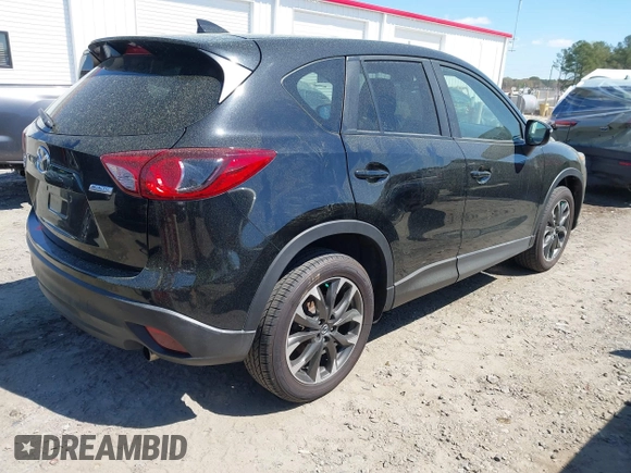 2016 Mazda CX-5 Grand Touring with VIN JM3KE4DY9G0893174, listed as a IAAI auction lot 41887814 with 79,811 mi miles. Bid and sale history available at carsss.com. Image 4.