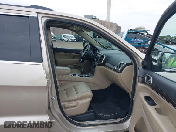 2014 Jeep Grand Cherokee Limited z VIN 1C4RJFBG8EC408754, wystawiony jako IAAI lot #42612211 z przebiegiem 149 017 mil mil oraz . Historia ofert i sprzedaży dostępna na DreamBid. Obrazek 5.
