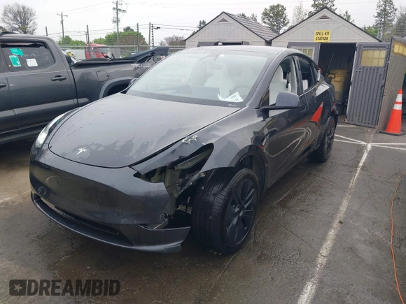 2025 Tesla Model Y Long Range with VIN 7SAYGDED8SA340082, listed as a IAAI auction lot 41915369 with 7,296 mi miles and . Bid and sale history available at DreamBid. Image 6.