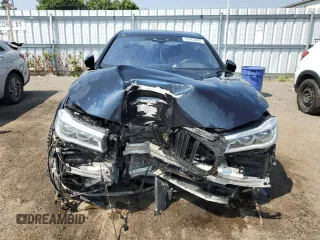 2017 BMW 7 Series 750i xDrive with VIN WBA7B0C57HG527064, listed as a Copart auction lot 62463405 with 103,454 mi miles and Salvage title. Bid and sale history available at DreamBid. Image 5.