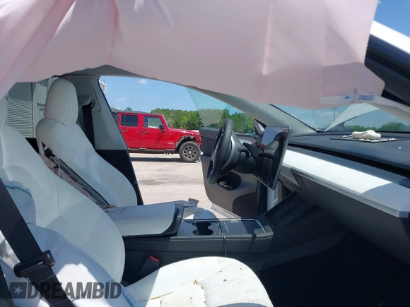 2023 Tesla Model Y Long Range with VIN 7SAYGDEE7PF865539, listed as a IAAI auction lot 42109673 with 34,923 mi miles and . Bid and sale history available at DreamBid. Image 5.