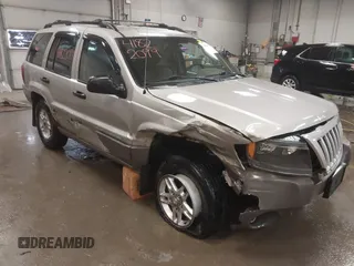 2004 Jeep Grand Cherokee Laredo with VIN 1J4GW48S44C321869, listed as a IAAI auction lot 41822099 with 181,663 mi miles. Bid and sale history available at carsss.com. Image 6.