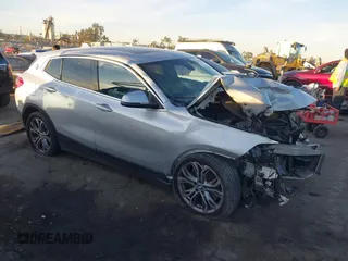 2019 BMW X2 sDrive28i with VIN WBXYJ3C54KEP77217, listed as a IAAI auction lot 41079851 with 100,149 mi miles. Bid and sale history available at carsss.com. Image 1.