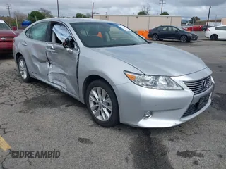2015 Lexus ES 300h with VIN JTHBW1GG1F2084938, listed as a IAAI auction lot 41761844 with 69,854 mi miles and . Bid and sale history available at DreamBid. Image 1.
