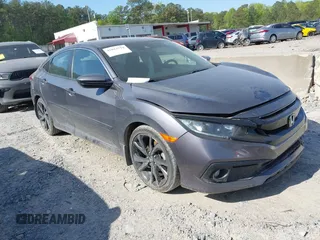 2019 Honda Civic Sport with VIN 2HGFC2F8XKH598141, listed as a IAAI auction lot 42013724 with 98,401 mi miles and . Bid and sale history available at DreamBid. Image 1.