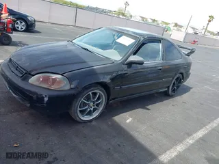 1997 Honda Civic EX with VIN 1HGEJ8243VL096134, listed as a IAAI auction lot 41929243 with 206,195 mi miles. Bid and sale history available at carsss.com. Image 12.