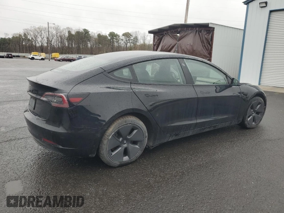 2021 Tesla Model 3 Standard Range Plus with VIN 5YJ3E1EA2MF087879, listed as a Copart auction lot 51853235 with 65,477 mi miles and Non Repairable. Bid and sale history available at carsss.com. Image 3.