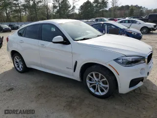2015 BMW X6 xDrive35i with VIN 5UXKU2C55F0F96006, listed as a Copart auction lot 50830585 with 128,479 mi miles and Salvage Title. Bid and sale history available at carsss.com. Image 4.