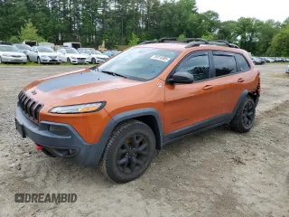 2016 Jeep Cherokee Trailhawk with VIN 1C4PJMBS2GW255368, listed as a Copart auction lot 59010305 with 105,667 mi miles and Salvage title. Bid and sale history available at DreamBid. Image 1.