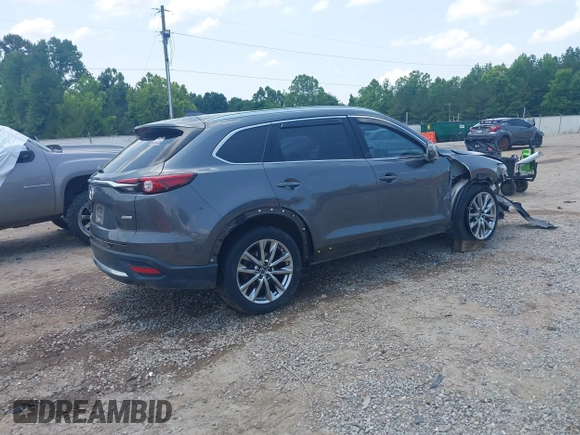 2018 Mazda CX-9 Grand Touring with VIN JM3TCADY7J0217595, listed as a IAAI auction lot 42381331 with 130,604 mi miles and . Bid and sale history available at DreamBid. Image 4.