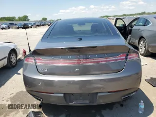 2014 Lincoln MKZ Hybrid z VIN 3LN6L2LU3ER806204, wystawiony jako Copart lot #56291185 z przebiegiem 258 082 mil mil oraz Szkoda całkowita • Salvage title. Historia ofert i sprzedaży dostępna na DreamBid. Obrazek 6.