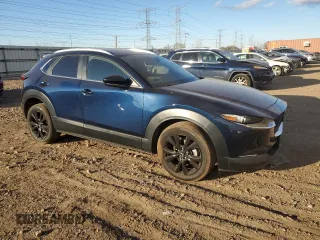 2022 Mazda CX-30 2.5 Turbo with VIN 3MVDMBAY8NM459690, listed as a Copart auction lot 84376874 with 24,723 mi miles and Salvage Title. Bid and sale history available at DreamBid. Image 4.