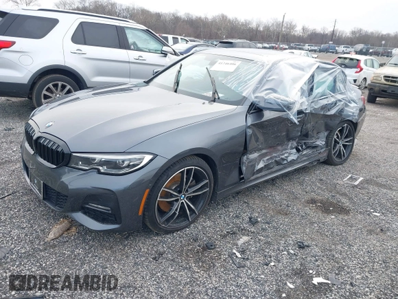 2019 BMW 3 Series 330i xDrive with VIN WBA5R7C54KFH24284, listed as a IAAI auction lot 41246406 with 57,200 mi miles. Bid and sale history available at carsss.com. Image 2.