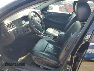 2016 Chevrolet Impala LTZ with VIN 2G1WC5E35G1142854, listed as a Copart auction lot 57105865 with 119,829 mi miles and Salvage title. Bid and sale history available at DreamBid. Image 7.