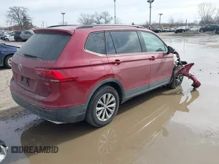 2018 Volkswagen Tiguan S with VIN 3VV1B7AX9JM085312, listed as a IAAI auction lot 41656827 with 122,322 mi miles and . Bid and sale history available at DreamBid. Image 4.