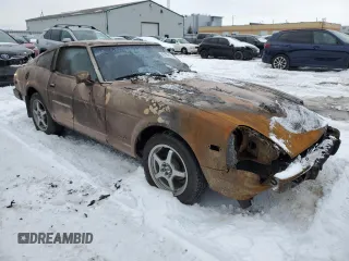 1979 Datsun 280ZX z VIN HS130137808, wystawiony jako Copart lot #43799165 z przebiegiem 28 995 mil mil oraz Tytuł czysty. Historia ofert i sprzedaży dostępna na DreamBid. Obrazek 4.