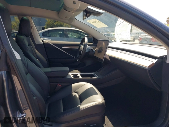 2023 Tesla Model 3 with VIN 5YJ3E1EAXPF405588, listed as a IAAI auction lot 42348952 with 30,788 mi miles and . Bid and sale history available at DreamBid. Image 5.