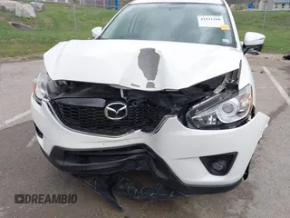 2015 Mazda CX-5 Touring with VIN JM3KE2CY3F0550624, listed as a IAAI auction lot 41931268 with 51,588 mi miles and . Bid and sale history available at carsss.com. Image 6.