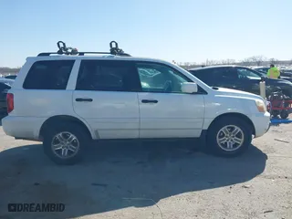 2005 Honda Pilot EX-L with NAVI with VIN 2HKYF18775H571312, listed as a IAAI auction lot 41830609 with 297,923 mi miles. Bid and sale history available at carsss.com. Image 13.