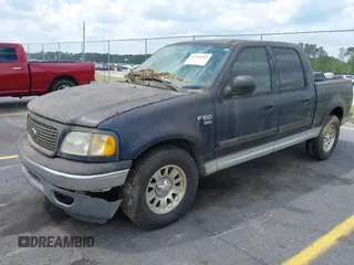 2003 Ford F-150 XLT with VIN 1FTRW076X3KC61967, listed as a IAAI auction lot 42016065 with 206,256 mi miles. Bid and sale history available at carsss.com. Image 2.