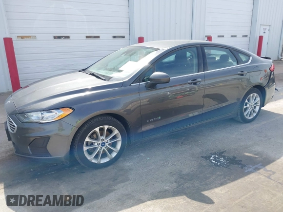 2019 Ford Fusion Hybrid SE with VIN 3FA6P0LU6KR163927, listed as a IAAI auction lot 41834612 with 104,342 mi miles. Bid and sale history available at carsss.com. Image 18.