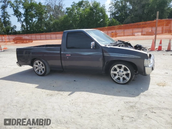 1996 Nissan Frontier XE z VIN 1N6SD11S0TC311270, wystawiony jako Copart lot #53870965 z przebiegiem 145 595 mil mil oraz Szkoda całkowita • Salvage title. Historia ofert i sprzedaży dostępna na DreamBid. Obrazek 4.