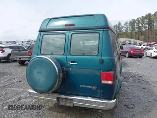 1995 Chevrolet Chevy Van z VIN 1GBEG25K0SF243254, wystawiony jako IAAI lot #41915622 z przebiegiem 74 262 mil mil oraz . Historia ofert i sprzedaży dostępna na DreamBid. Obrazek 16.