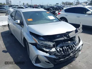 2021 Toyota Prius LE with VIN JTDKAMFP1M3180370, listed as a IAAI auction lot 41928512 with 83,249 mi miles and . Bid and sale history available at DreamBid. Image 1.