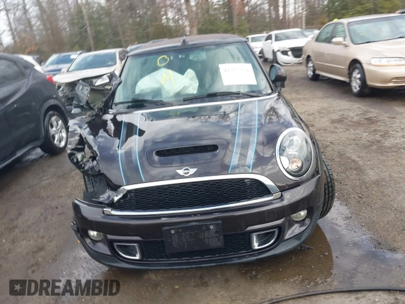 2013 MINI Convertible S with VIN WMWZP3C54DT297304, listed as a IAAI auction lot 41377572 with 101,991 mi miles and . Bid and sale history available at DreamBid. Image 12.