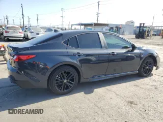 2025 Toyota Camry LE z VIN 4T1DAACK1SU539963, wystawiony jako Copart lot #57273015 z przebiegiem 991 mil mil oraz Szkoda całkowita • Salvage title. Historia ofert i sprzedaży dostępna na DreamBid. Obrazek 3.