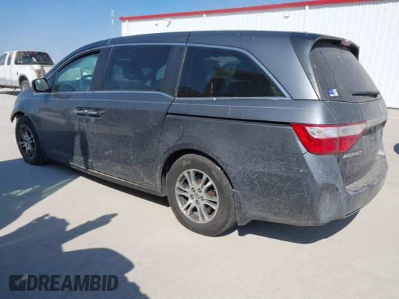 2012 Honda Odyssey EX-L with VIN 5FNRL5H69CB128585, listed as a IAAI auction lot 41695109 with 231,565 mi miles and . Bid and sale history available at carsss.com. Image 3.