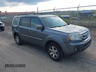 2011 Honda Pilot Touring with VIN 5FNYF4H90BB103824, listed as a IAAI auction lot 42127137 with 243,858 mi miles. Bid and sale history available at carsss.com. Image 1.