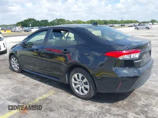 2023 Toyota Corolla LE with VIN JTDB4MEE2PJ004869, listed as a IAAI auction lot 42139964 with 41,119 mi miles. Bid and sale history available at carsss.com. Image 3.