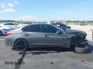 2014 Infiniti Q50 Premium with VIN JN1BV7AP0EM675221, listed as a IAAI auction lot 42551726 with 191,334 mi miles and . Bid and sale history available at DreamBid. Image 14.