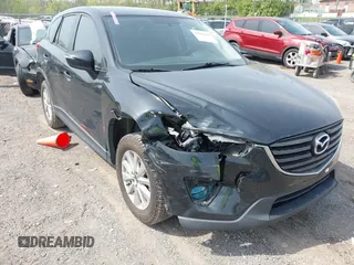 2016 Mazda CX-5 Sport with VIN JM3KE4BY8G0746377, listed as a IAAI auction lot 41990988 with 144,558 mi miles and . Bid and sale history available at carsss.com. Image 6.